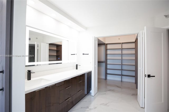 bathroom featuring tile flooring and vanity