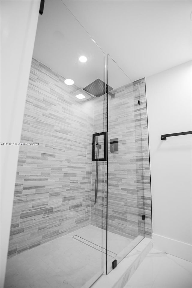 bathroom featuring an enclosed shower