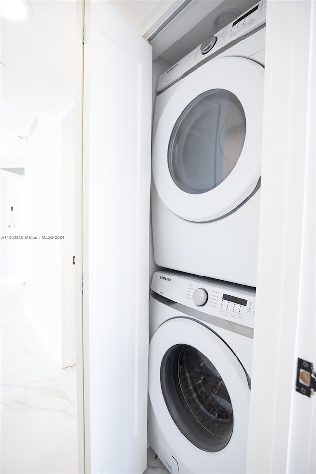 laundry room featuring stacked washing maching and dryer