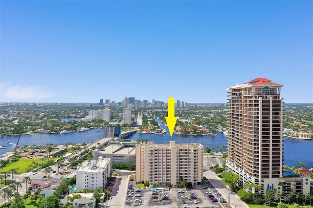 bird's eye view featuring a water view and a city view