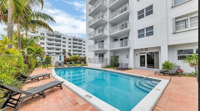 community pool featuring a patio area