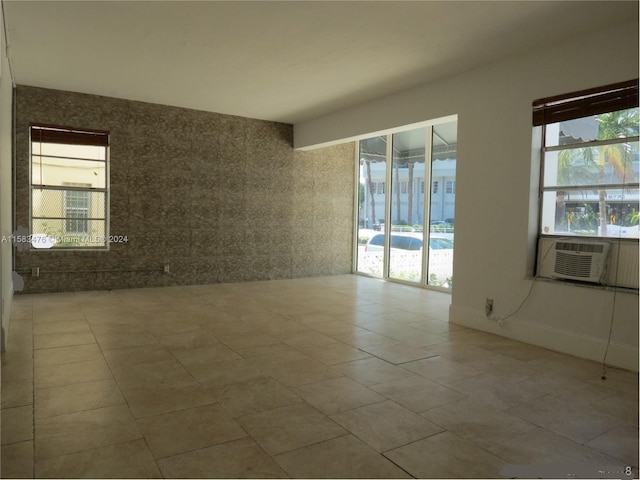 tiled empty room with plenty of natural light