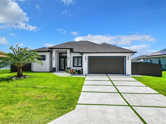 prairie-style home with a garage and a front yard