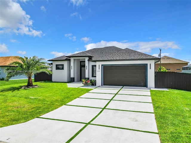 view of front of house with a garage and a front yard