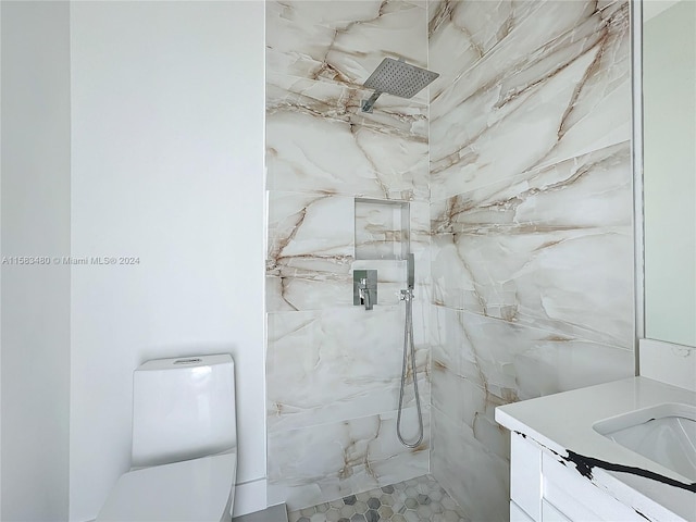 bathroom featuring vanity and a tile shower