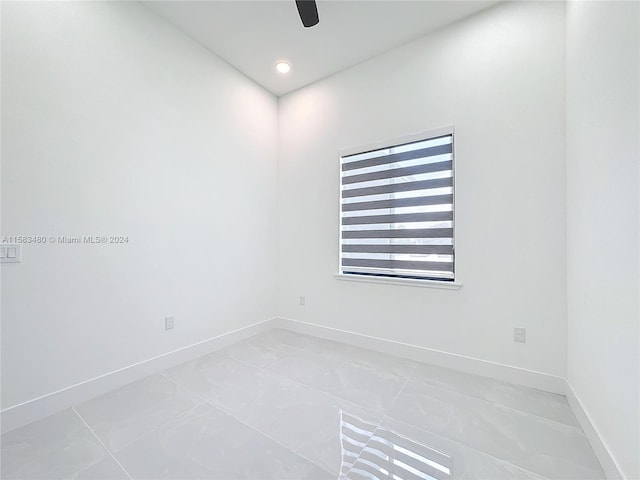 unfurnished room featuring light tile floors