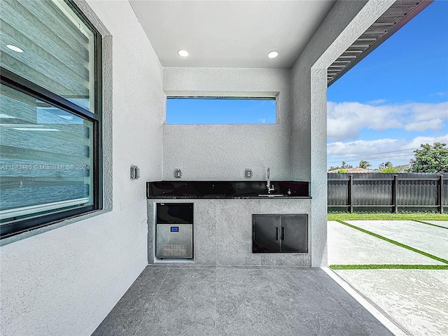 view of patio featuring exterior kitchen and sink