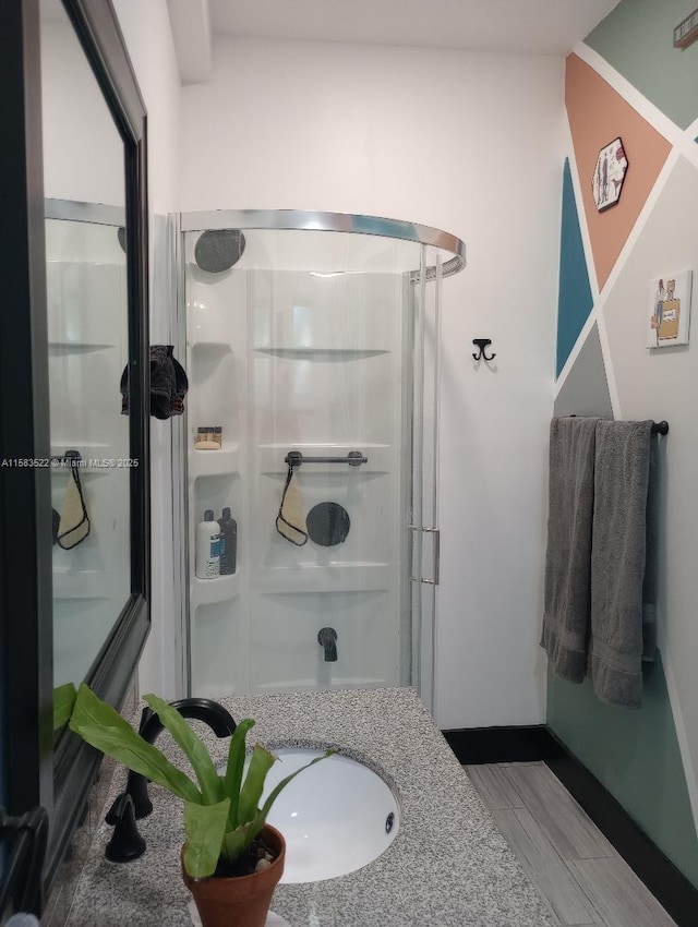 bathroom with a shower with shower door