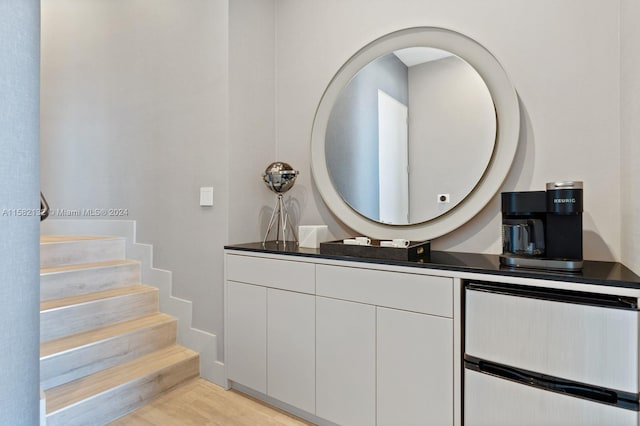 bathroom with vanity and wood-type flooring