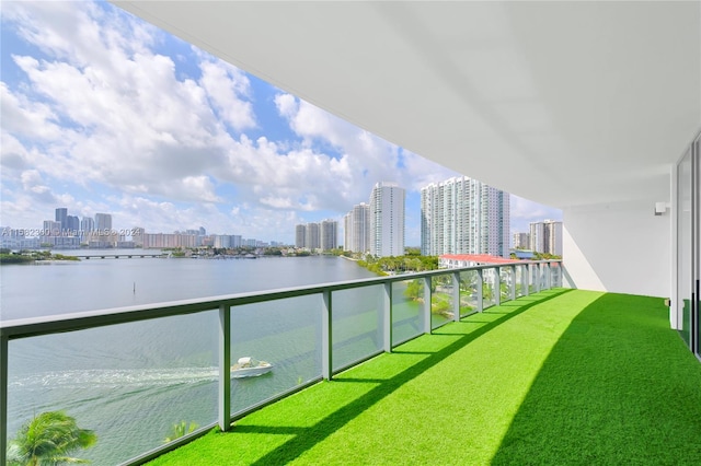 balcony featuring a water view