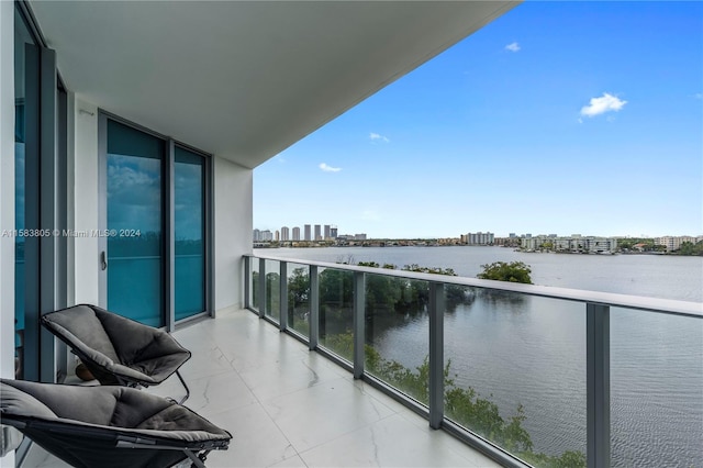 balcony featuring a water view