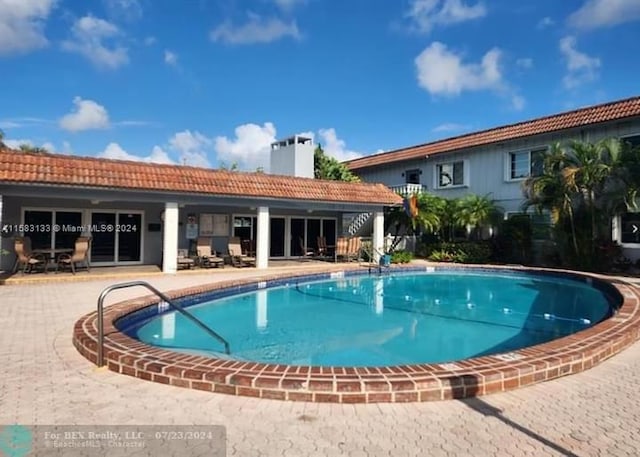 view of swimming pool with a patio