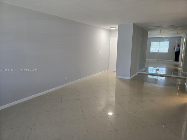 spare room with light tile patterned floors