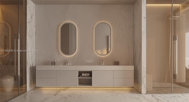 bathroom with a shower with door, oversized vanity, toilet, and dual sinks