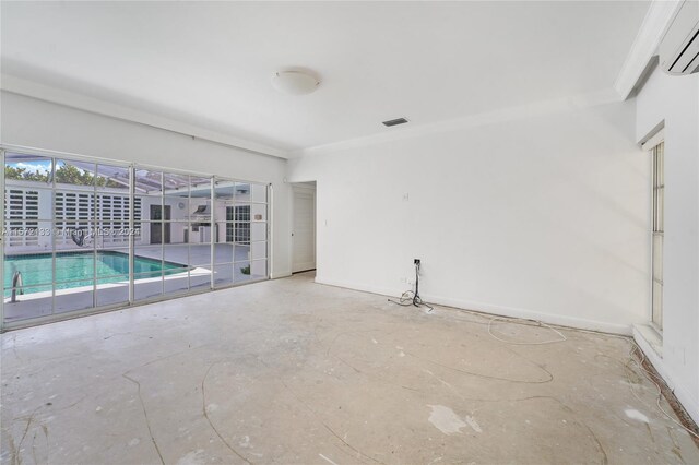 empty room featuring a wall mounted air conditioner
