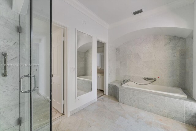 bathroom with ornamental molding, tile floors, and plus walk in shower