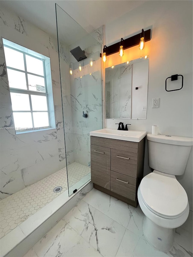 bathroom featuring vanity, toilet, tile floors, and a shower with door