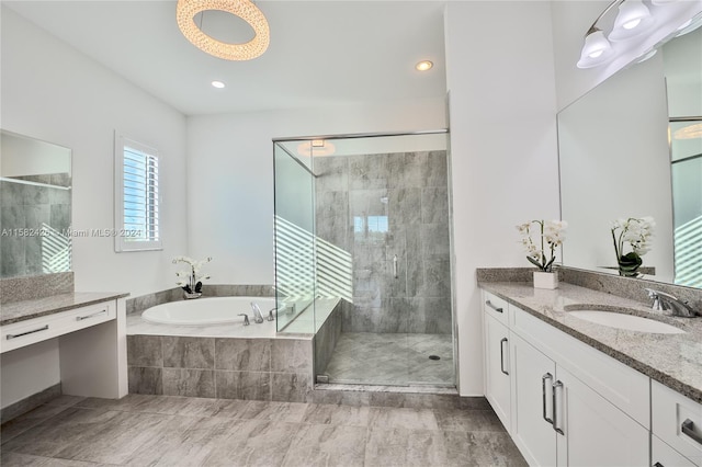 bathroom with plus walk in shower, vanity with extensive cabinet space, and tile flooring