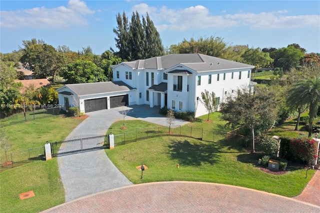 view of front facade with a garage and a front lawn