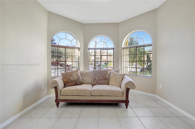 sitting room featuring plenty of natural light and light tile patterned flooring