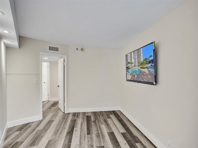 empty room with light hardwood / wood-style floors