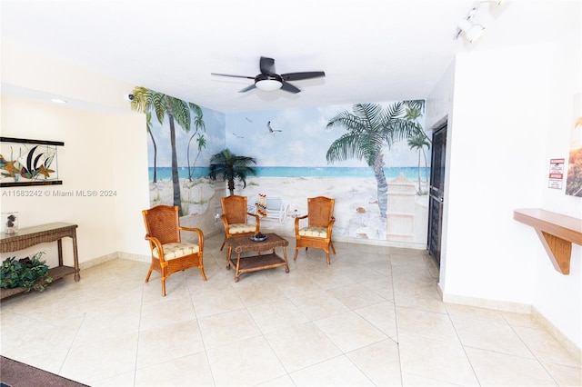 living area with light tile patterned flooring and ceiling fan