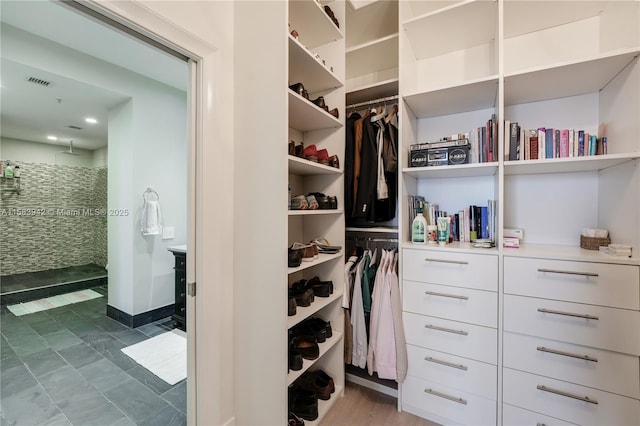 spacious closet featuring visible vents