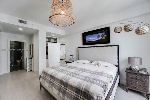 701 Brickell Key Blvd Unit Lph-06, Miami, FL 33131 - bedroom featuring light wood-style flooring and ensuite bathroom