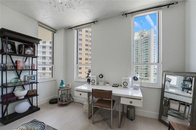 701 Brickell Key Blvd Unit Lph-06, Miami, FL 33131 - office space featuring light wood-style flooring, baseboards, and built in study area