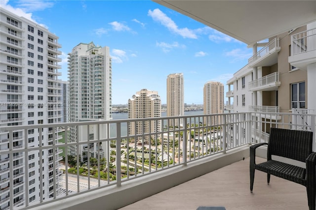 balcony with a city view and a water view