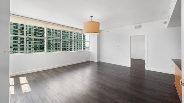 empty room featuring dark hardwood / wood-style floors