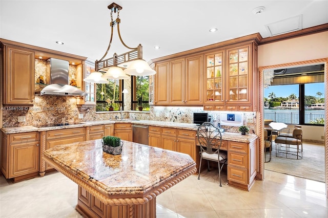 kitchen featuring dishwasher, a center island, hanging light fixtures, wall chimney range hood, and light tile patterned floors