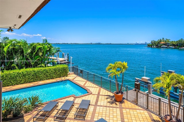 view of pool with a water view