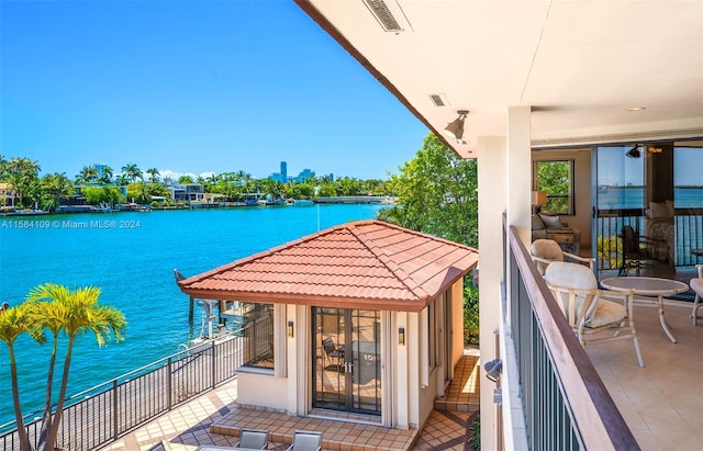 balcony featuring a water view