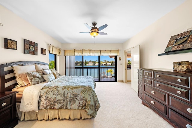 bedroom featuring light carpet, access to outside, and ceiling fan