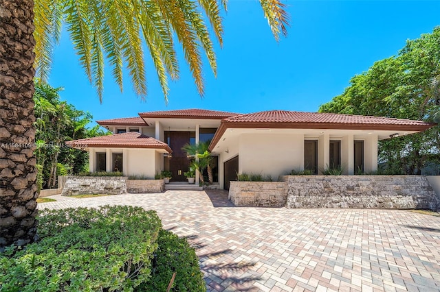 mediterranean / spanish house with a garage