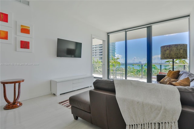 bedroom with tile flooring and floor to ceiling windows