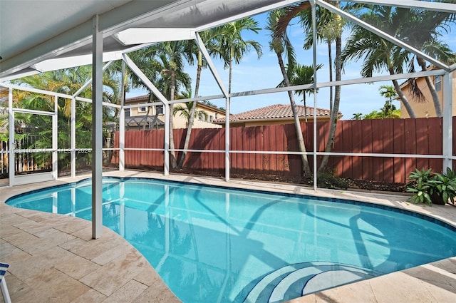 view of pool featuring a lanai and a patio