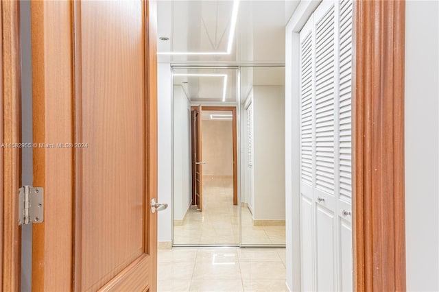 corridor with light tile floors