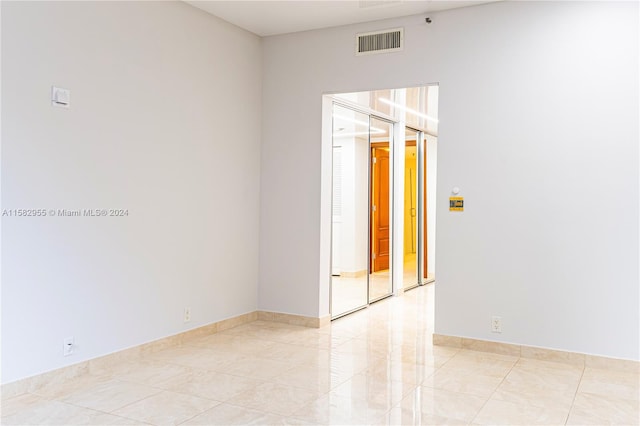 empty room featuring light tile floors