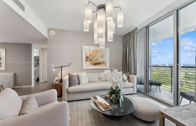 living room featuring floor to ceiling windows and light wood-type flooring