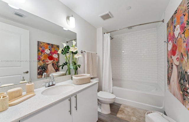 full bathroom with vanity, toilet, hardwood / wood-style floors, and shower / bathtub combination with curtain