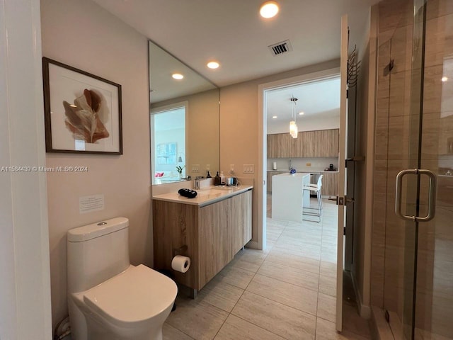 bathroom featuring walk in shower, toilet, tile floors, and vanity