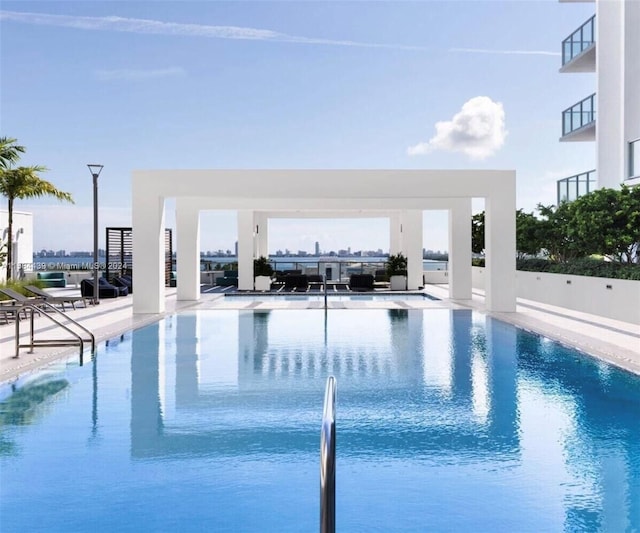 view of swimming pool featuring a patio