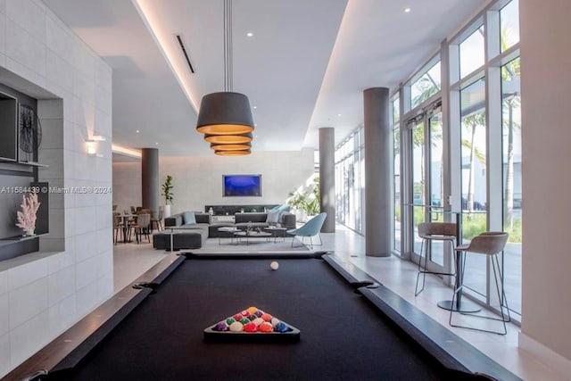 game room with plenty of natural light and billiards