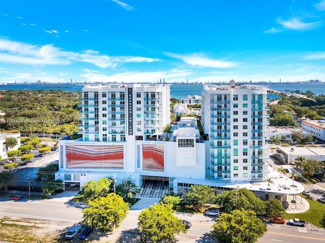 birds eye view of property with a water view