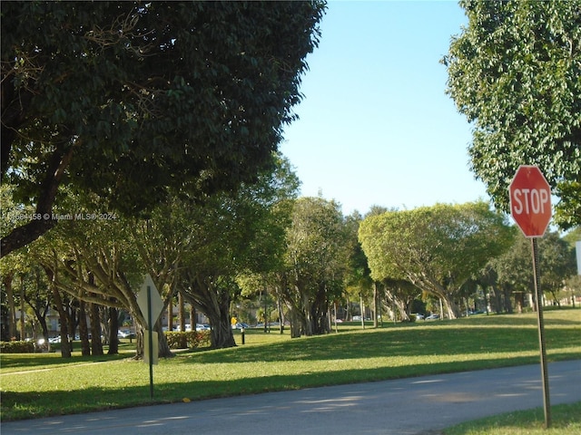 view of home's community featuring a lawn