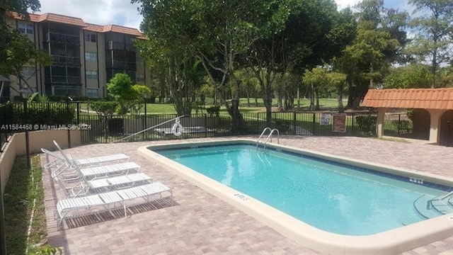 view of pool featuring a pergola and a patio