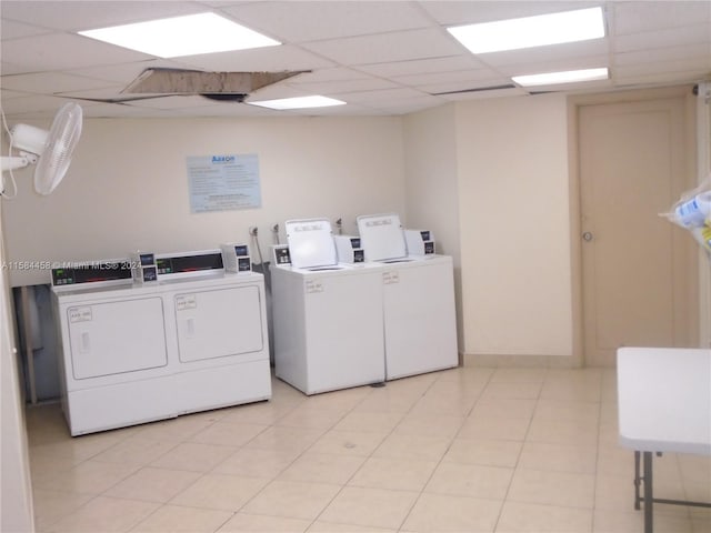 laundry area featuring light tile patterned flooring and separate washer and dryer