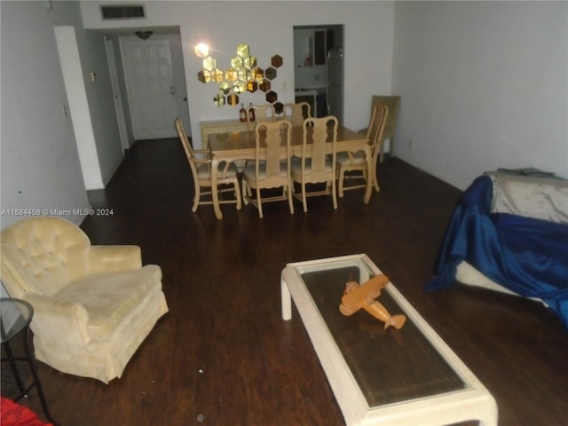 dining space featuring dark hardwood / wood-style flooring